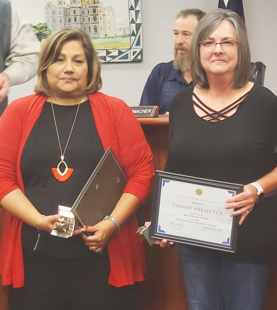In the photo at top, Gigi Ousley and Tammy Niemeyer receive awards having been named Difference Makers for the month of November.
