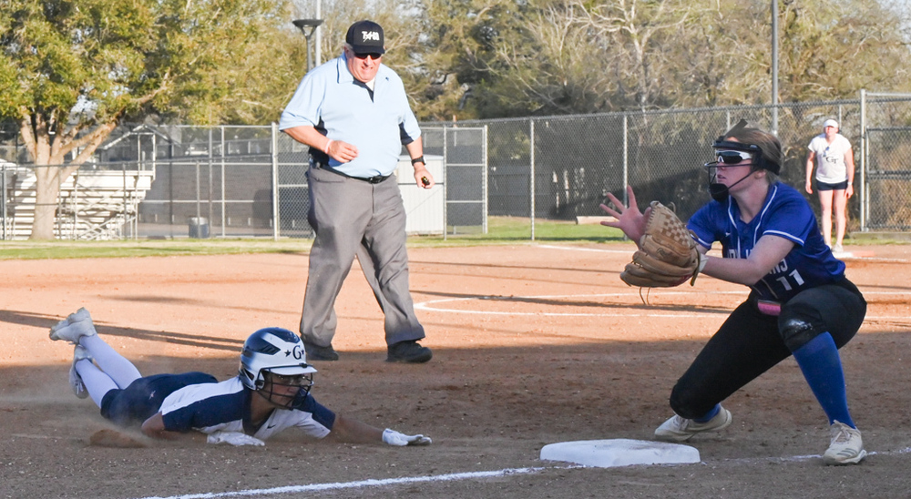 Photo of Dayla Perry sliding in to third base