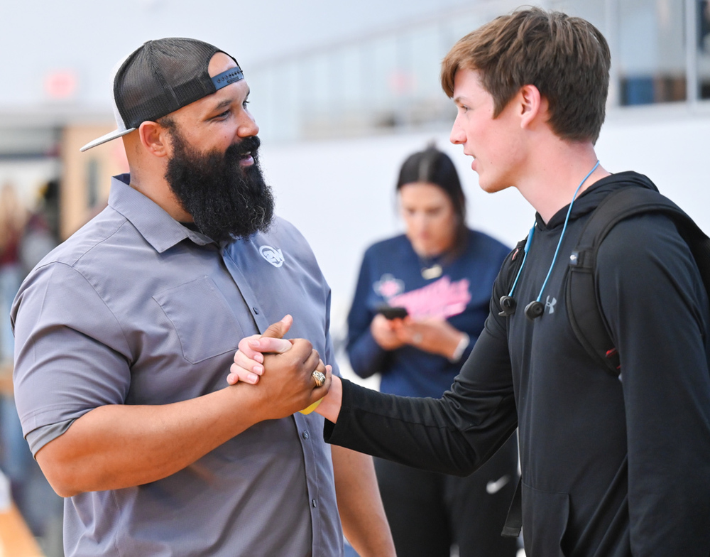 Photo of Coach Mackey with student